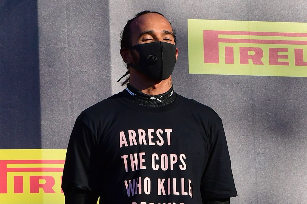 Lewis Hamilton making a statement on the podium after winning the Tuscan Grand Prix in Italy on September 13. Photo AFP