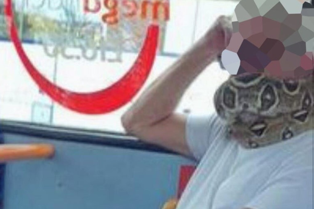 Photos of the man, dressed in a white T-shirt and jeans, showed what appeared to be a python coiled around his neck and face. Photo: Press Association