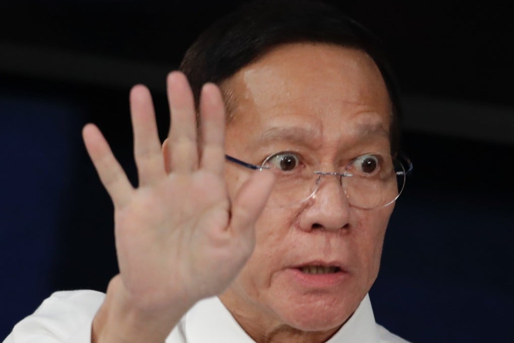 Philippine health secretary Francisco Duque gestures during a press conference in March. Photo: EPA
