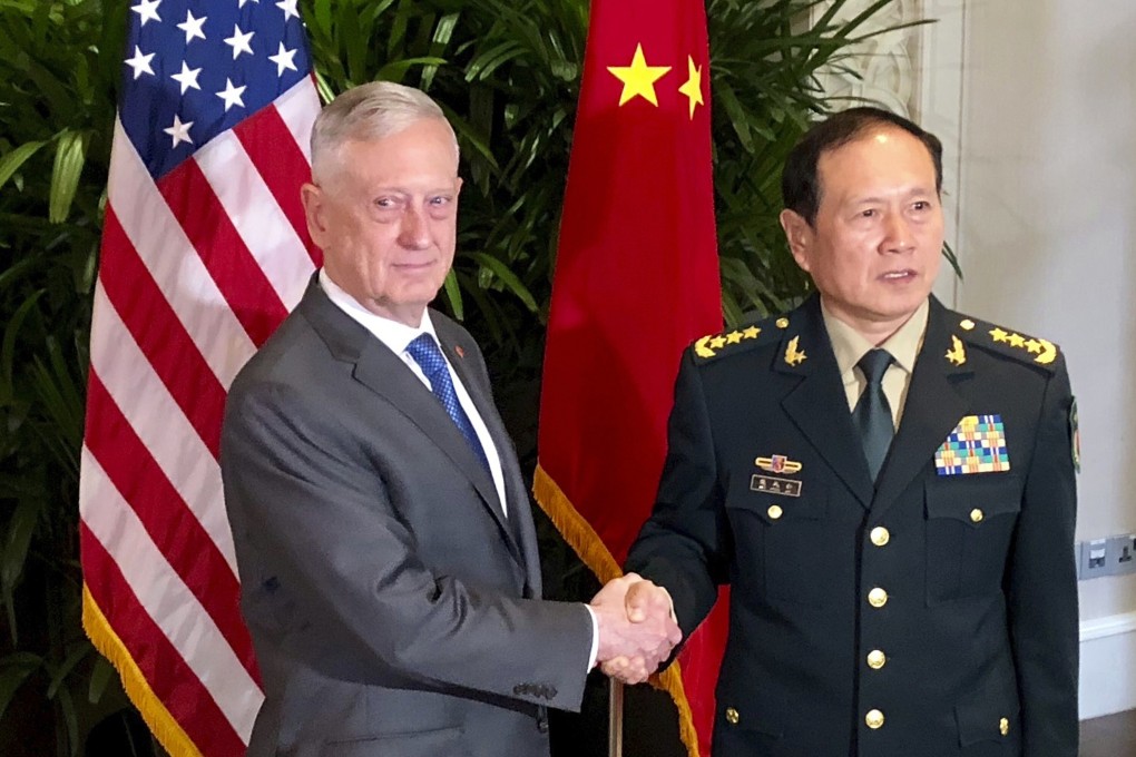 Then US defence secretary James Mattis meets Chinese Defence Minister Wei Fenghe in Singapore in October 2018. Mattis later told Wei the whole world was watching how the two superpowers managed their differences, according to the book Rage. Photo: AP