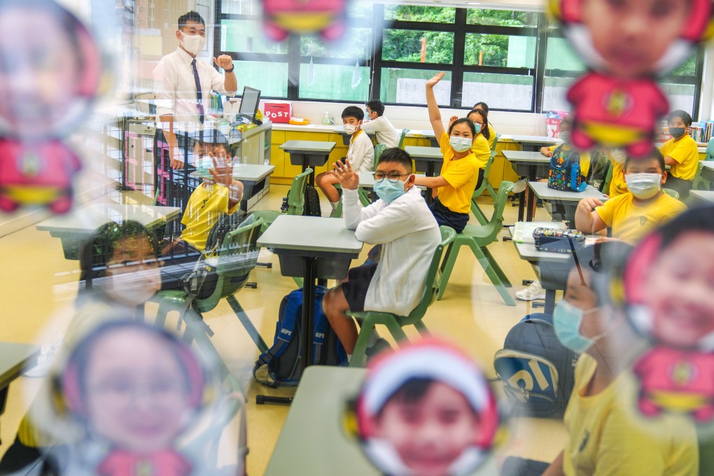 Students at SKH St James’ Primary School in Wan Chai mark their return to campus on Wednesday. Photo: Sam Tsang