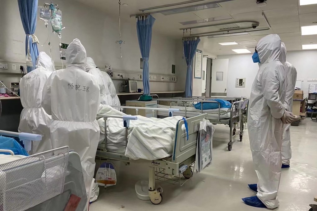 Medical workers treat Covid-19 patient Zhang Lifa, father of Zhang Hai, on January 30 at a hospital in Wuhan. Zhang Hai has emerged as a vocal advocate and spokesman for families of virus victims. Photo: AFP/Zhang Hai