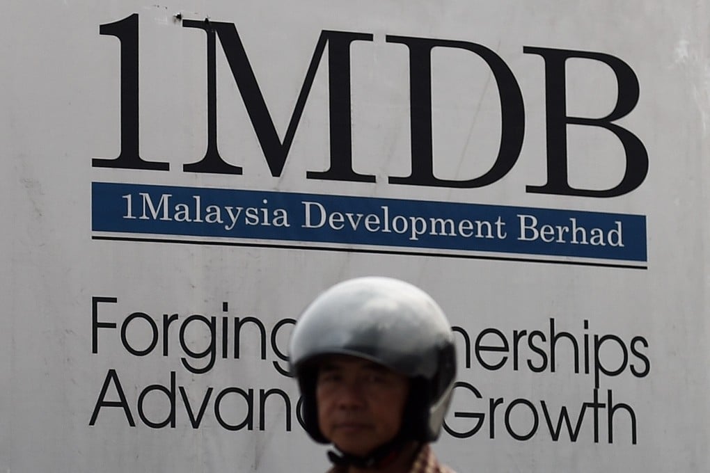 A 1 Malaysia Development Berhad (1MDB) poster at a construction site in Kuala Lumpur. The US has recovered or assisted Malaysia in recovering nearly US$1.1 billion in assets from the fund so far. Photo: AFP