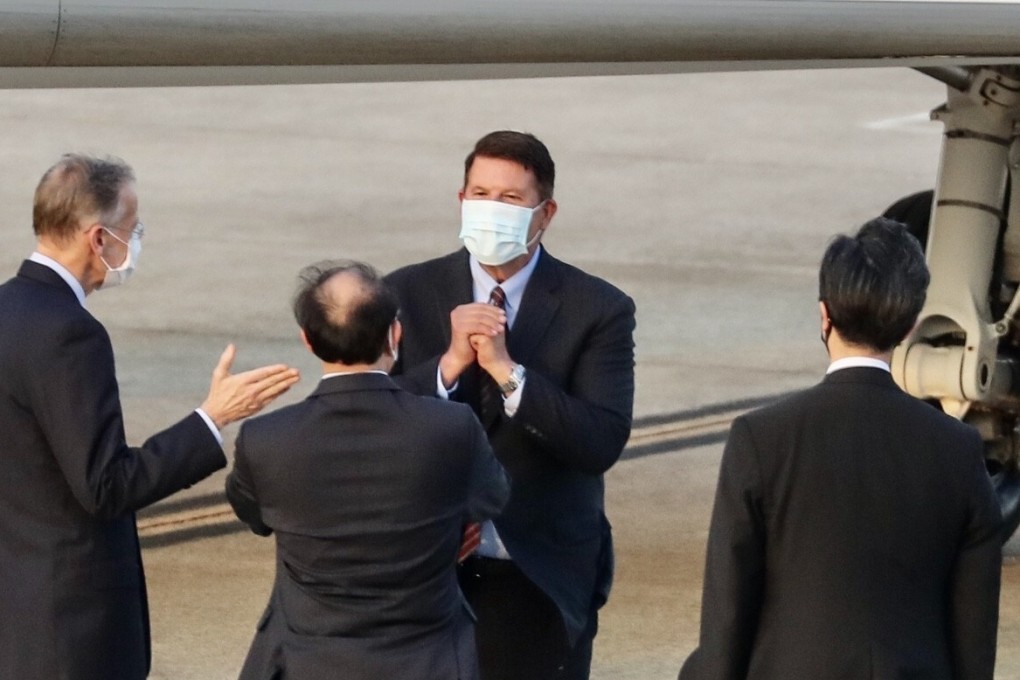 Keith Krach (centre) gestures after landing at the Songshan airport in Taipei on Thursday. Photo: AFP