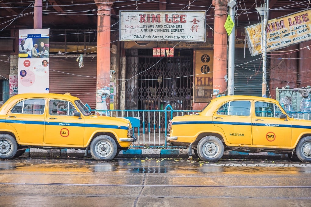 Indian yellow taxis in front of a Chinese store in Chinatown in Kolkata, India. Photo: Shutterstock