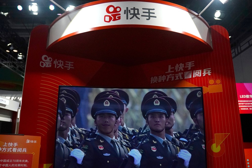 A screen showing footage of a military parade is seen at a booth of Chinese video-streaming start-up Kuaishou at the 2020 China International Fair for Trade in Services in Beijing. Photo: Reuters