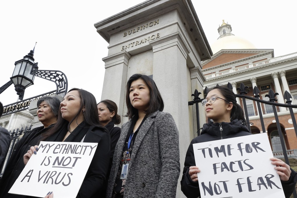 Asian-Americans condemn coronavirus-related racism outside the Massachusetts statehouse in Boston. Photo: AP