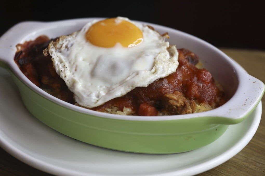 Baked Kurobuta pork chop with fried rice and sunny side up egg at Loyal Dining in Wan Chai. Photo: Jonathan Wong