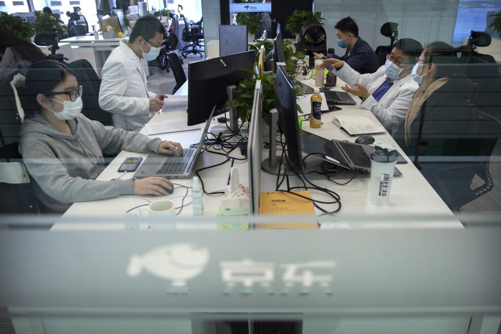 JD Health doctors use computers to chat online as they consult with patients at the JD.com headquarters in Beijing on March 27. Photo: AP