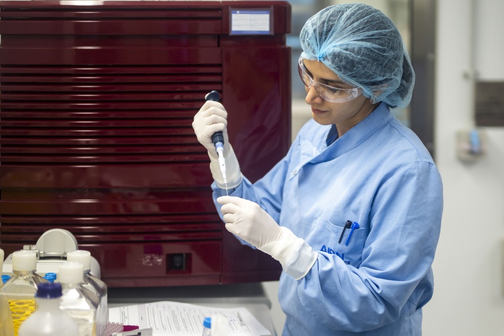 A researcher works at a University of Queensland (UQ) laboratory, as part of an effort to develop a potential Covid-19 vaccine. Photo: Xinhua