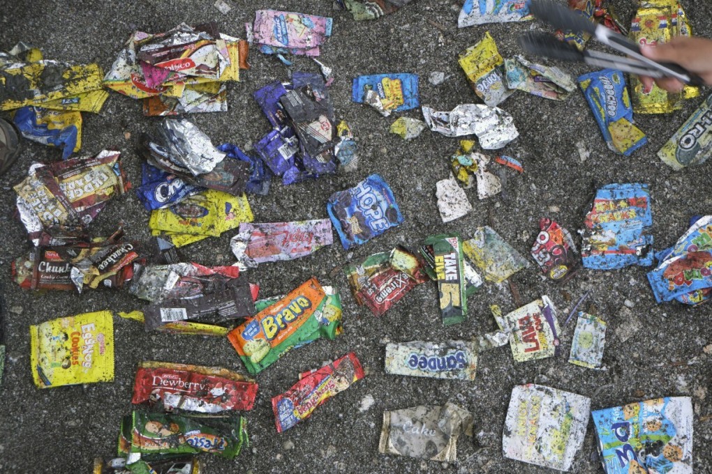 Different kinds of sachets litter the ground in the Philippines. Our grab-and-go culture means packaging has grown smaller and more numerous. Photo: Break Free From Plastic Movement