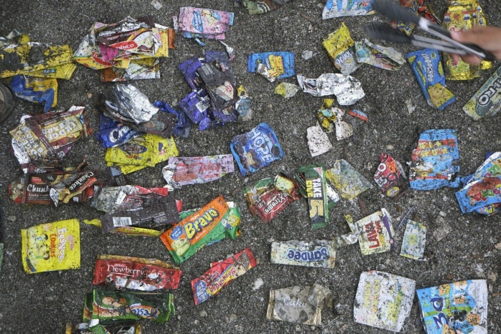 Different kinds of sachets litter the ground in the Philippines. Our grab-and-go culture means packaging has grown smaller and more numerous. Photo: Break Free From Plastic Movement
