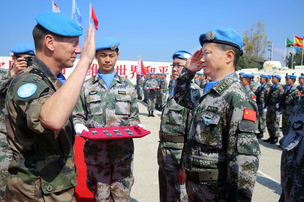 A Chinese colonel receives a UN peace medal on behalf of the Chinese peacekeeping force in southern Lebanon in 2017. China is the second-largest contributor to the UN after the US. Photo: Xinhua
