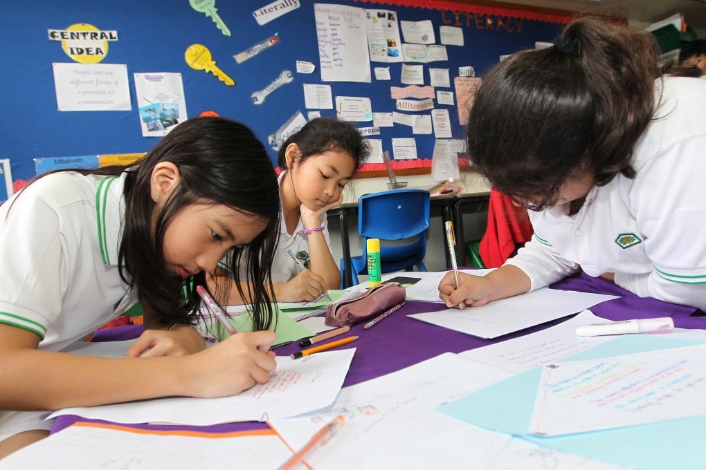 Students work on an assignment at an international school in Tai Po. Photo: SCMP
