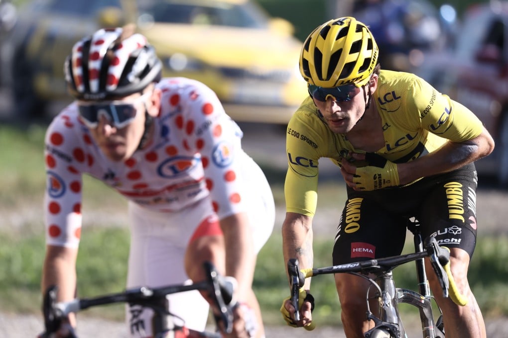 Team UAE Emirates rider Tadej Pogacar wearing the best climber's polka dot jersey (left) and Team Jumbo rider Primoz Roglic battle it out on the Glieres plateau during the 18th stage of the 107th edition of the Tour de France. Photo: AFP