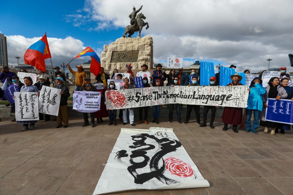 Protesters in Ulan Bator hold a banner reading “save the Mongolian language” during a demonstration last week against China’s decision to expand use of Mandarin instead of Mongolian in Inner Mongolia. Photo: EPA-EFE