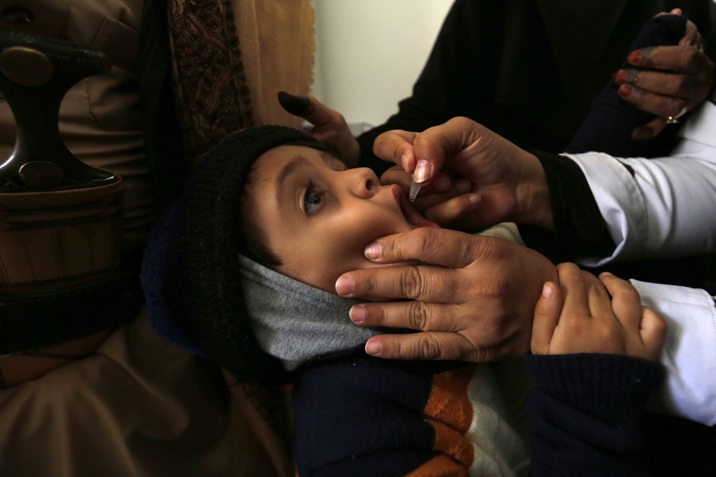 A Unicef health worker administers a vaccination to a child during an anti-polio campaign at a health centre in Sanaa, Yemen, on November 27, 2018. The UN and its agencies continue to do indispensable work around the world despite its members and donors consistently overpromising and underfunding its operations. Photo: EPA