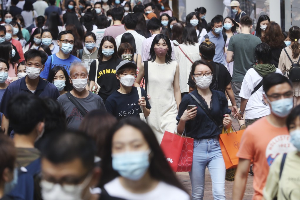 People wear masks in Hong Kong’s Causeway Bay. The city is still trying to snuff out a third wave of Covid-19 infections. Photo: Edmond So