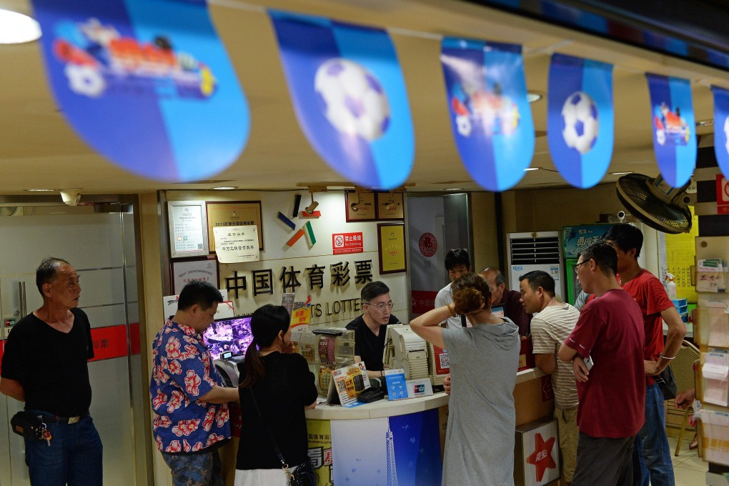 Chinese fans buy sports lottery tickets for the 2018 Fifa World Cup. Photo: AFP