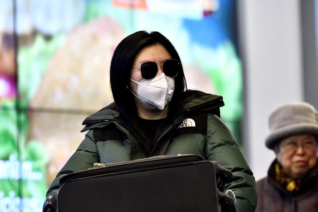 A traveller arrives at Vancouver’s International Airport in Richmond, British Columbia, on January 24. Masks were already prevalent in Richmond that month, long before they were recommended by Canadian health authorities. Photo: Reuters