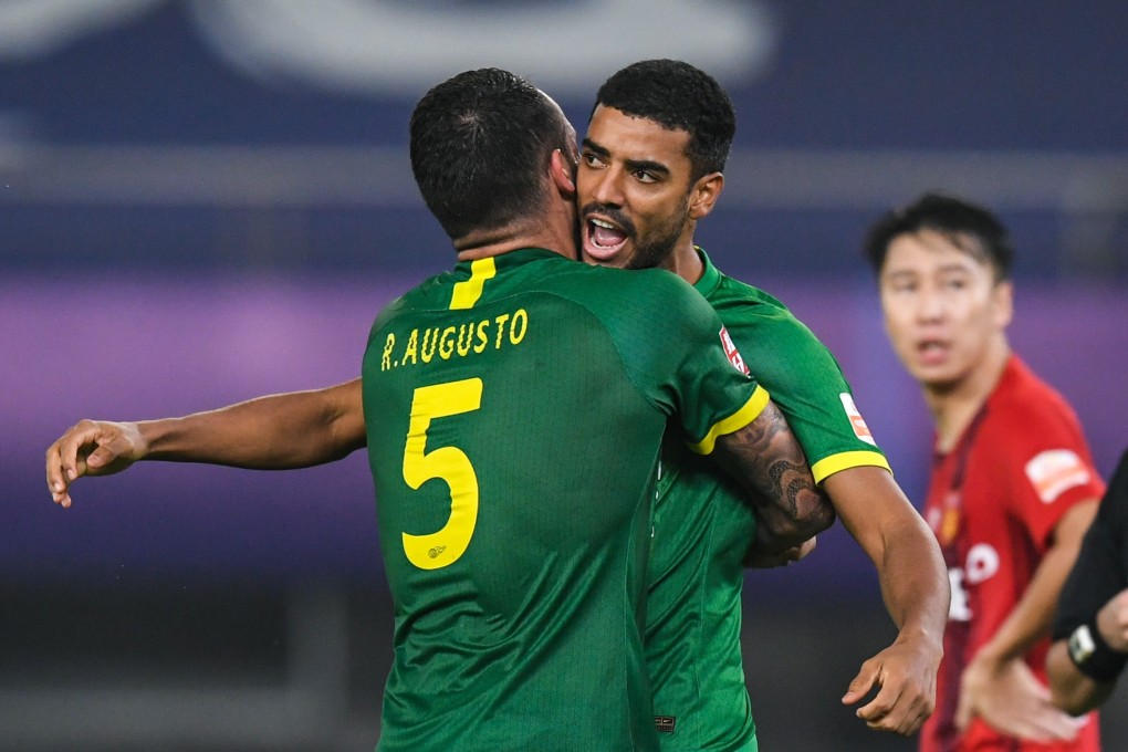 Alan Carvalho of Beijing Guoan celebrates with teammate Renato Augusto in the Chinese Super League. The naturalised China striker scored twice in his team’s Chinese FA Cup win. Photo: Xinhua