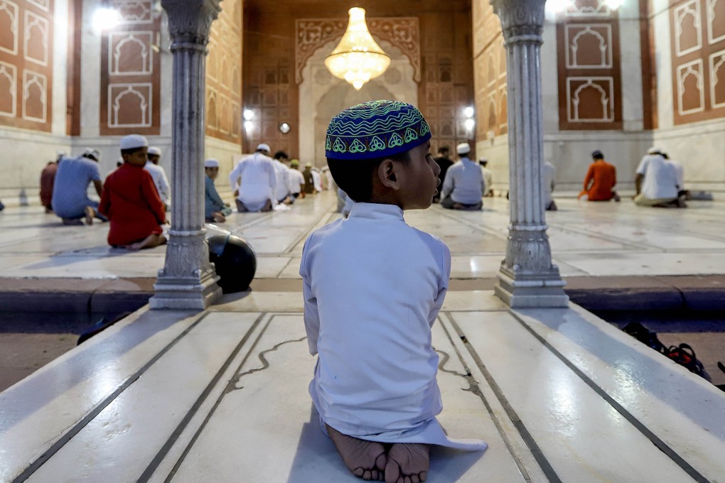Devotees pray during the religious festival of Eid ul-Fitr in Jama Masjid, Delhi, India. Many ceremonies have been cancelled across the country due to the coronavirus pandemic. Photo: Amarjeet Kumar Singh