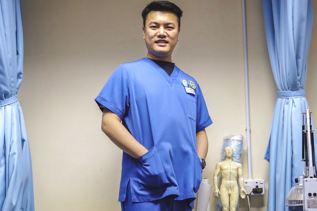 Dr Douglas Shum offers free traditional Chinese medicine consultations through his Light of Raphael clinic in Chai Wan. Photo: Nora Tam