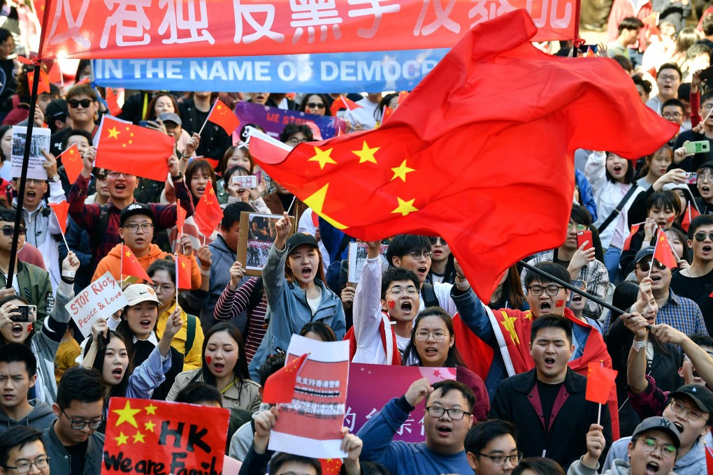 Pro-China activists march on the streets of Sydney in August 2019. Photo: AFP