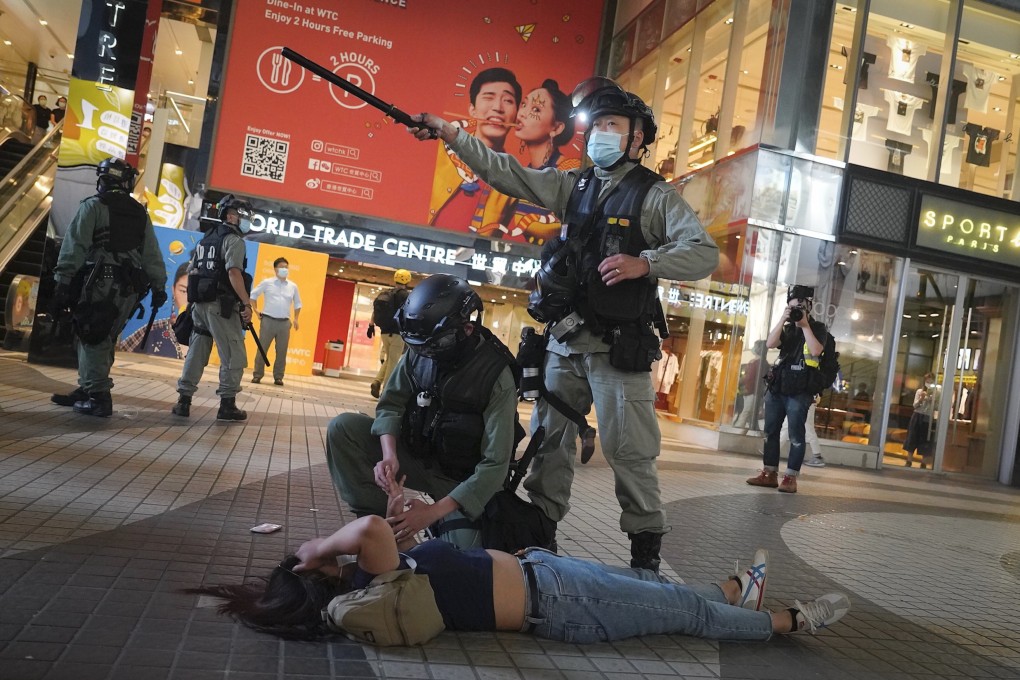 Hong Kong riot police detain a protester in Causeway Bay, Hong Kong, on June 12. Photo: AP
