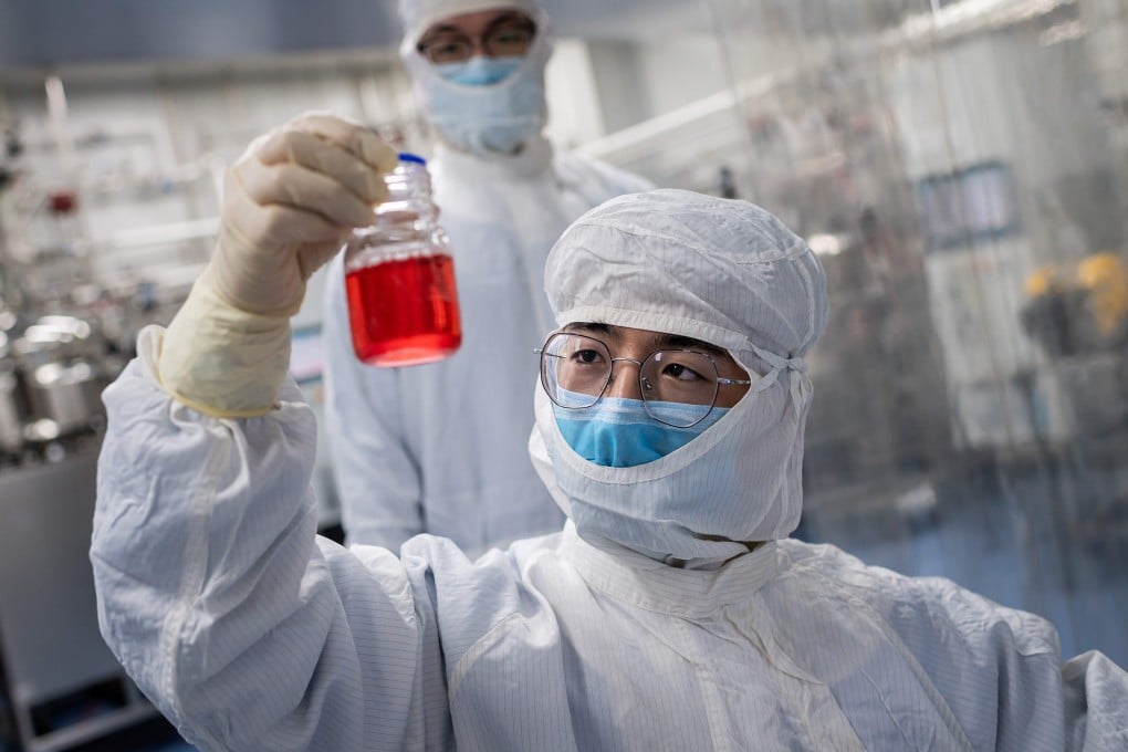 A researcher at the Sinovac Biotech facilities in Beijing prepares a test on an experimental vaccine for the Covid-19 coronavirus. Photo: AFP