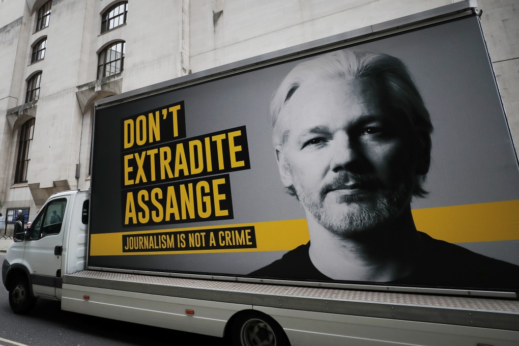 A truck with a billboard of Julian Assange arrives at the Old Bailey court in London as his extradition hearing continues. Photo: AP
