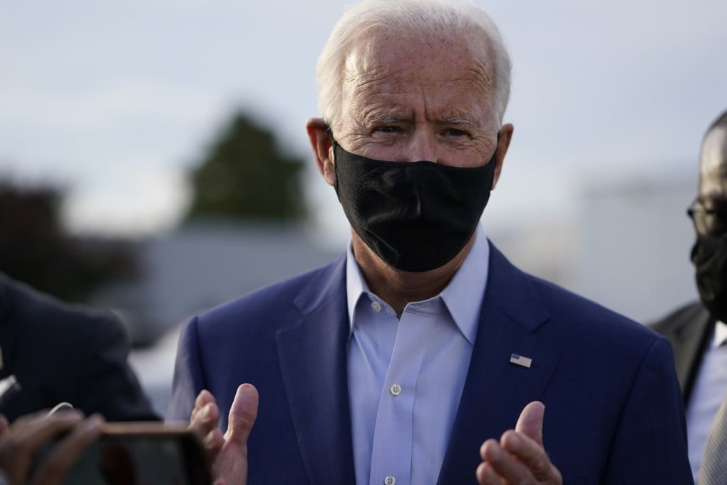 Democratic presidential candidate Joe Biden speaks to reporters before boarding a plane in Delaware on Wednesday. Photo: AP