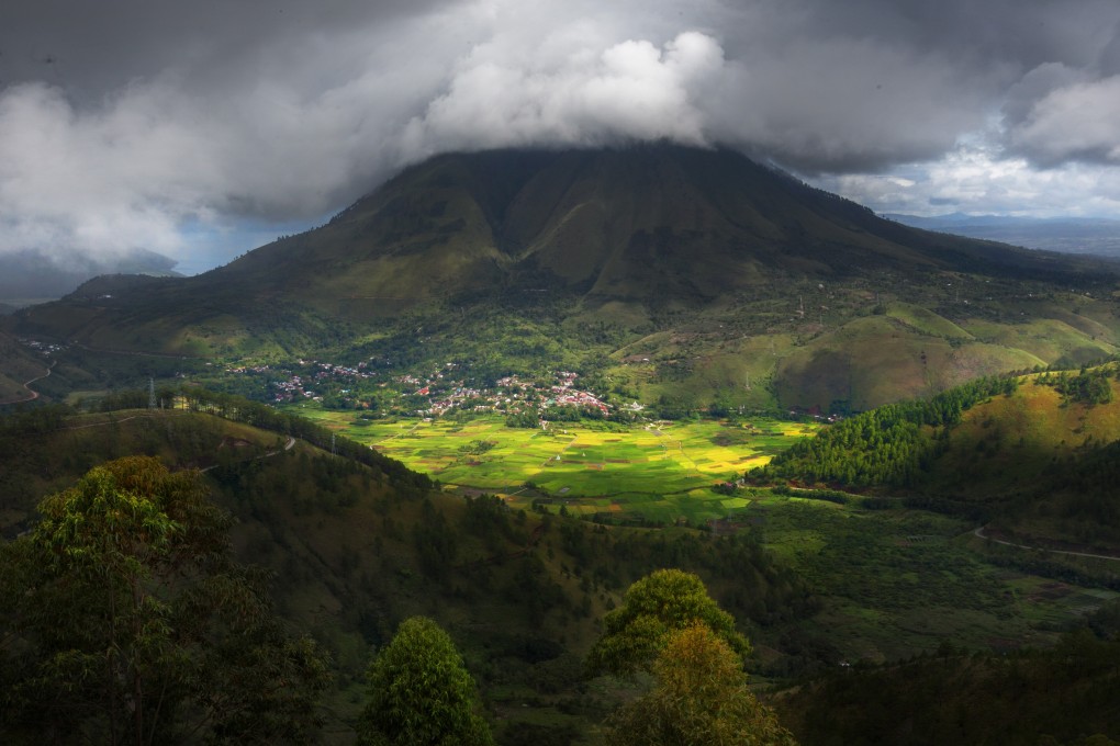 Lake Toba in Sumatra, Indonesia, is in the caldera of the supervolcano that erupted 74,000 years ago. Photo: Shutterstock Images
