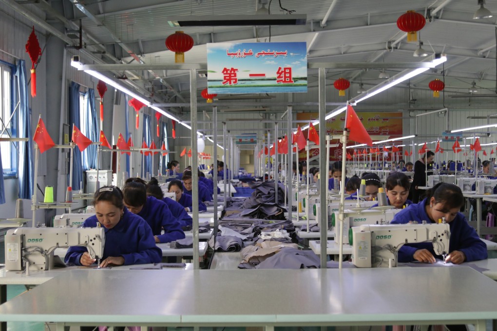 Uygur women see working in a clothing factory in Hotan county in Xinjiang autonomous region.