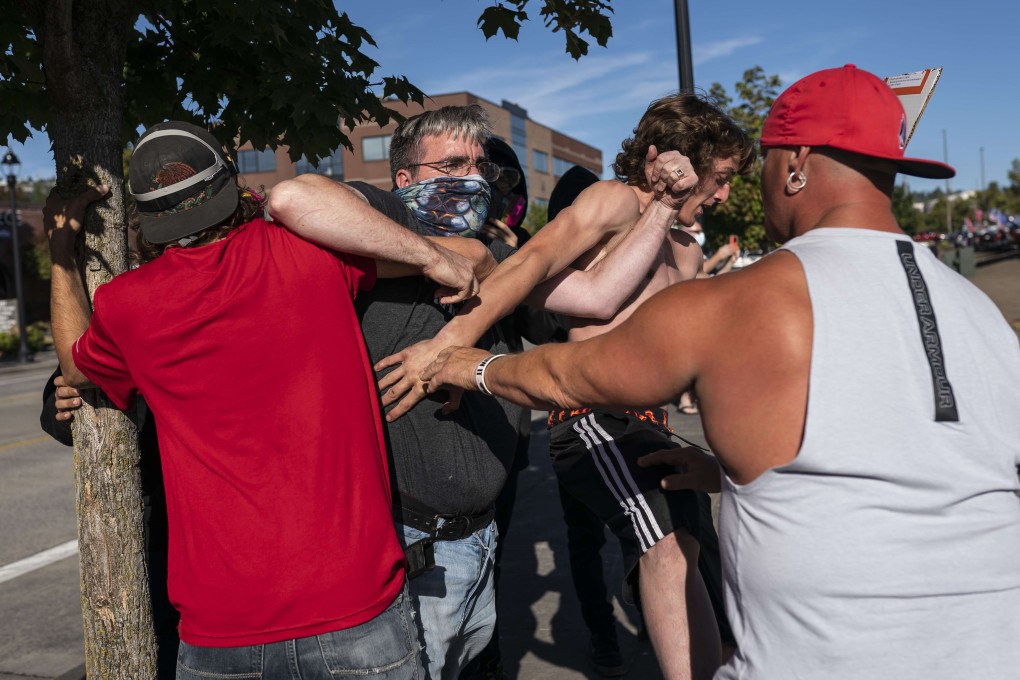 Black Lives Matter protesters and Trump supporters get into a scuffle in Clackamas, Oregon, on August 29. Photo: AFP