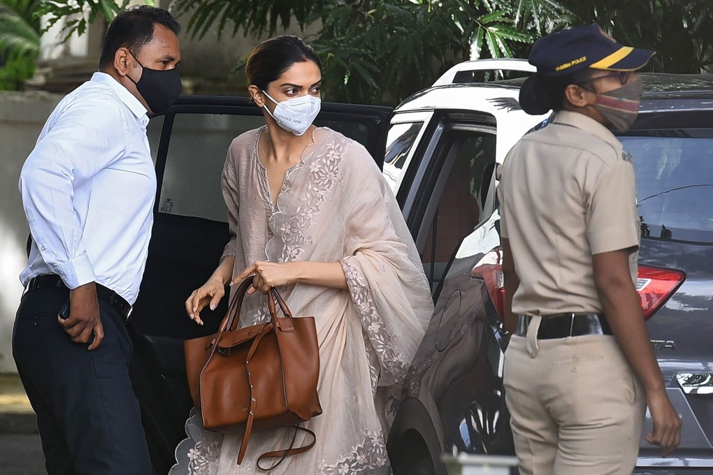 Bollywood actress Deepika Padukone, centre, arrives to attend questioning by Narcotics Control Bureau officials in Mumbai on Saturday. Photo: AFP