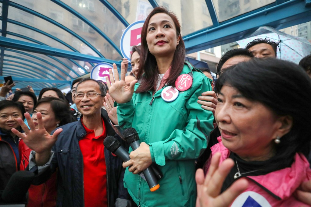 Flanked by politically allies, then-Legco candidate and now-ousted lawmaker Chan Hoi-yan (centre) canvasses in Mei Foo in 2018. Photo: Edward Wong