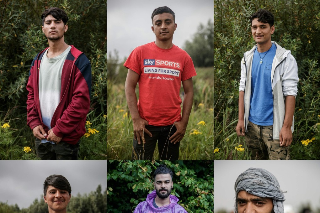 Pictures shows migrants posing at a makeshift camp in the outskirts of Calais in northern France. Photo: AFP