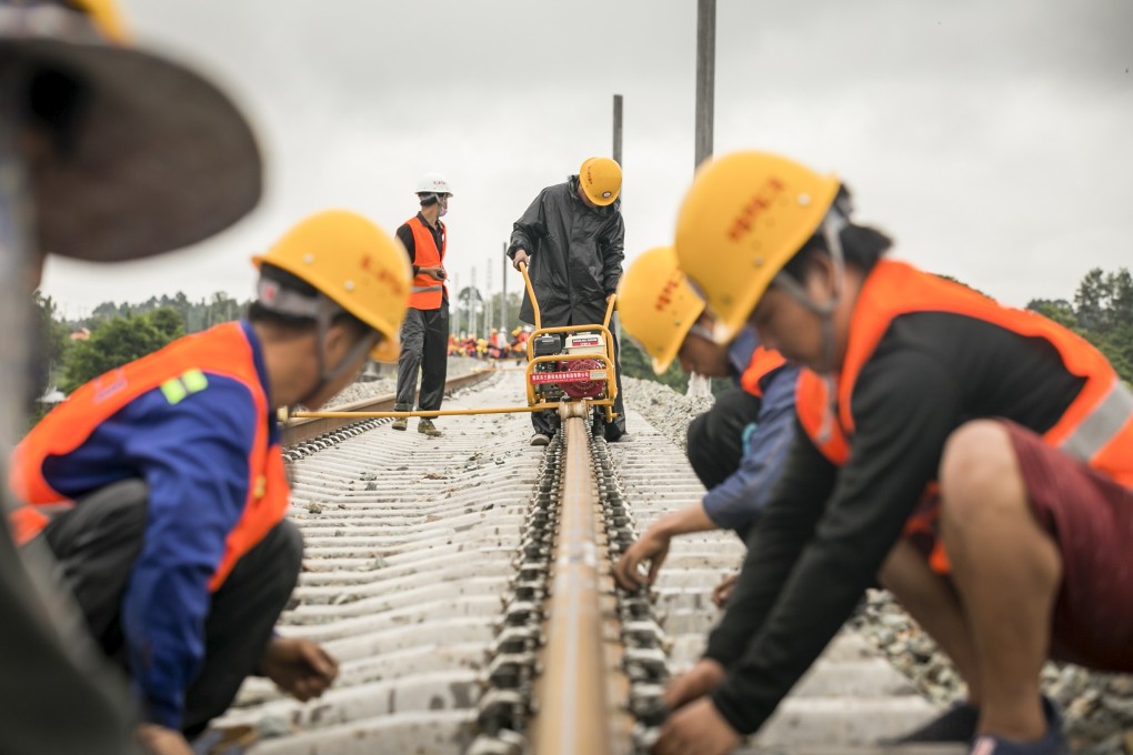 Workers from China Railway No 2 Engineering Group work on a section of the China-Laos railway in Vientiane, Laos, on June 18. Market economies have become passive in their approach to growth, and lack vision, such as that embodied in China’s Belt and Road Initiative. Photo: Xinhua