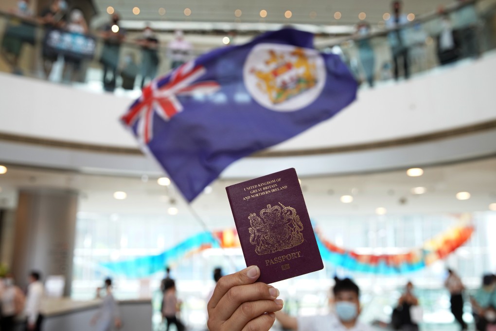 A protester holds a BN(O) passport during a lunch-hour rally in Hong Kong. Photo: Winson Wong