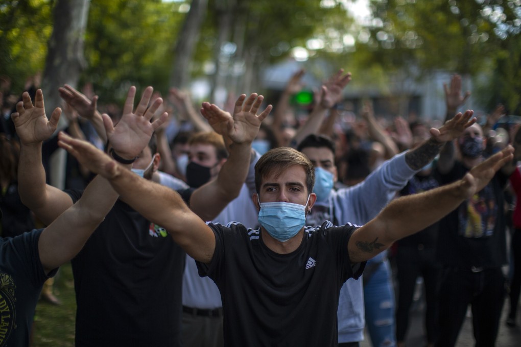Protesters take part in a demonstration against coronavirus measures in Madrid. Photo: AP Photo