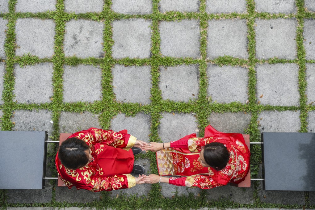 A Hong Kong same-sex couple who married overseas attend an LGBT event calling for equal marriage rights, in Central on May 25, 2019. The day before, same-sex marriage had become legal in Taiwan, albeit with some caveats. Photo: Sam Tsang