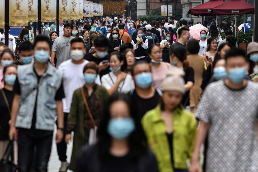 People in Wuhan are out and about wearing masks on September 27, 2020. A new study by Chinese data scientists say in the early days of the outbreak in Wuhan, the virus reproduction number was 7.9. Photo: AFP