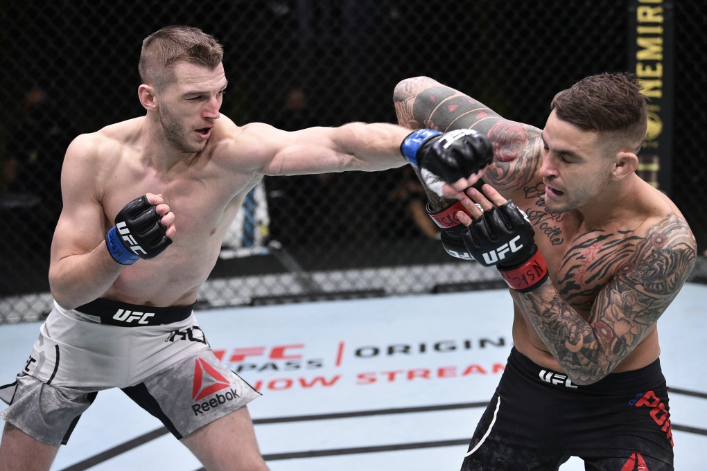 Dan Hooker punches Dustin Poirier during UFC Fight Night at the UFC Apex. Photo: Chris Unger/Zuffa LLC via USA TODAY Sports