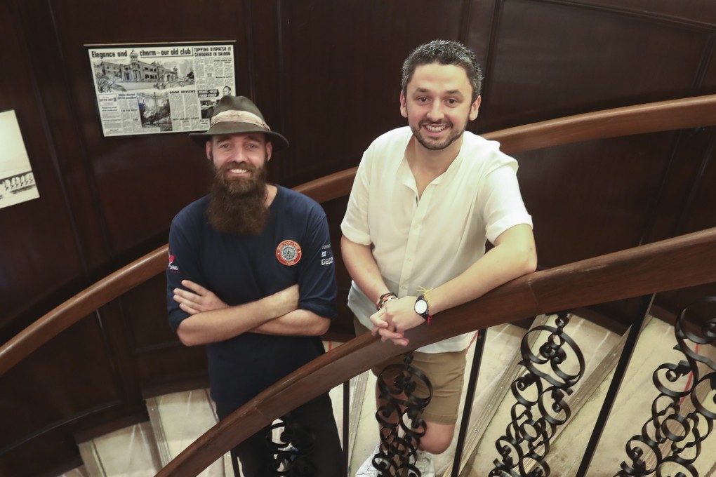 Torbjorn Pedersen (left) and Daniel Herszberg met up at the Foreign Correspondents’ Club in Central, Hong Kong, to share their experiences after both had to abandon attempts on world travel records due to the coronavirus outbreak. Photo: Jonathan Wong