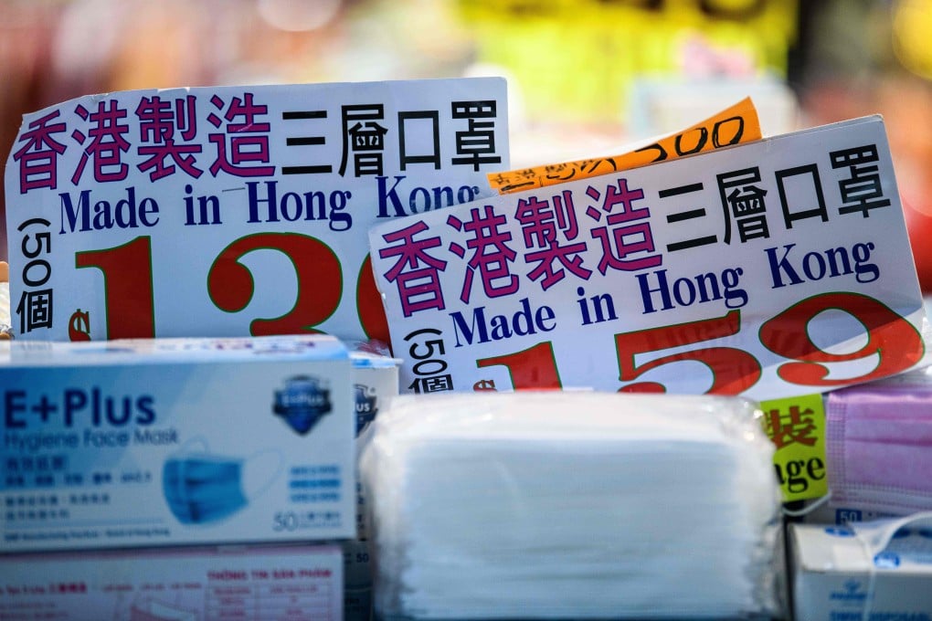 Notices reading ‘Made in Hong Kong’ are displayed among face masks for sale as the city battles a third wave of the coronavirus pandemic, on August 12. Hong Kong has formally objected to Washington’s demand that locally made US exports be labelled ‘Made in China’ after September 25. Photo: AFP