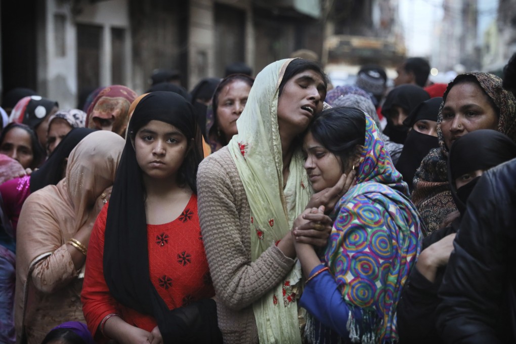 Relatives and neighbours mourn the death of Mohammad Mudasir, 31, killed in communal violence in New Delhi on February 27. India’s minority Muslim community increasingly feel disempowered and isolated. Photo: AP