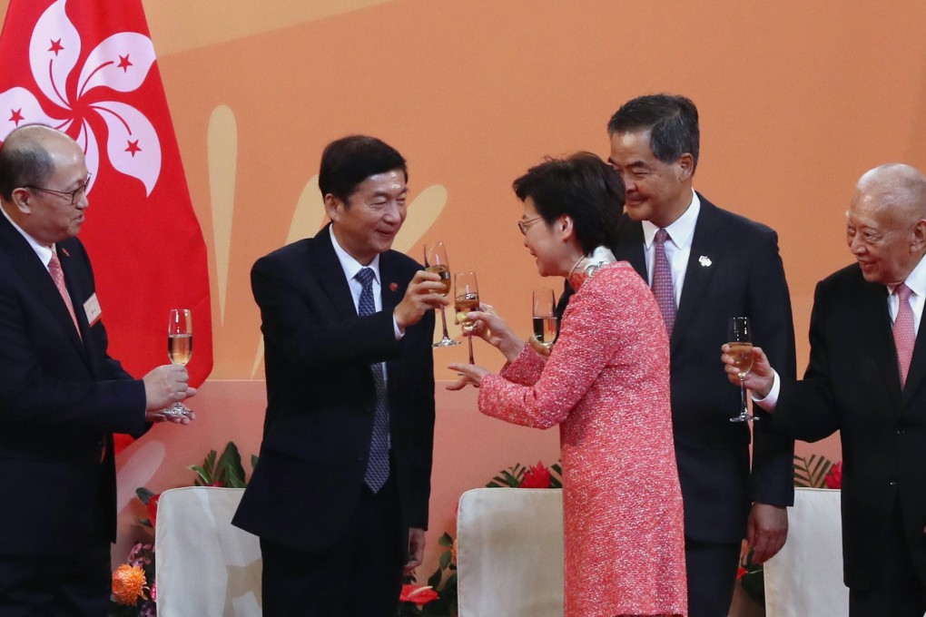 Chief Executive Carrie Lam Cheng Yuet-ngor raises a toast with Luo Huining, director of Beijing’s liaison office in Hong Kong, at the National Day reception in Wan Chai. With them are (from left) Zheng Yanxiong, director of the Office for Safeguarding National Security, and former Hong Kong chief executives Leung Chun-ying and Tung Chee-hwa. Photo: Nora Tam