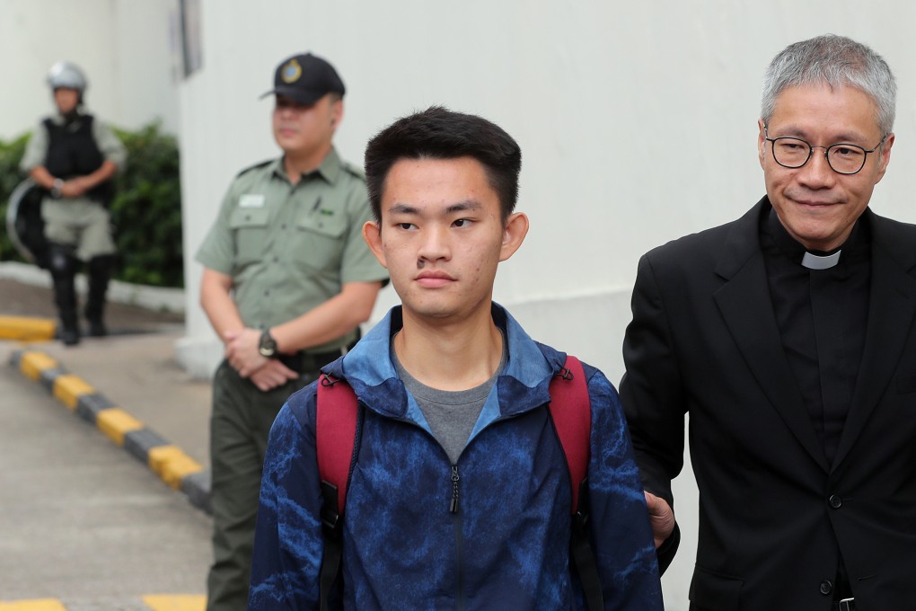 Chan Tong-kai (left) leaves Pik Uk Correctional Institution in Clear Water Bay in October last year, accompanied by Reverend Canon Peter Koon Ho-ming. Photo: Sam Tsang