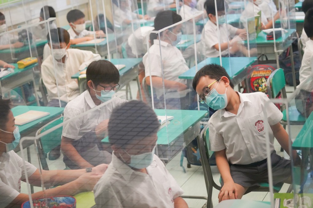 Students return to in-person classes at a primary school in Cheung Sha Wan on September 29. Nearly 900,000 pupils from all Hong Kong schools and kindergartens have returned to in-person classes for the first time in more than half a year amid the Covid-19 pandemic. Photo: Winson Wong